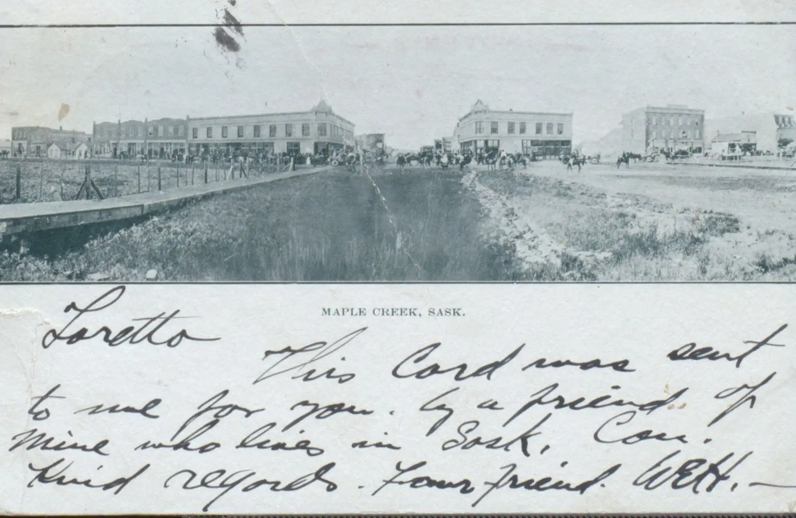 Street view of Maple Creek with horses and wagons