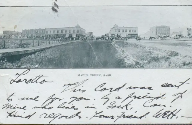 Street view of Maple Creek with horses and wagons
